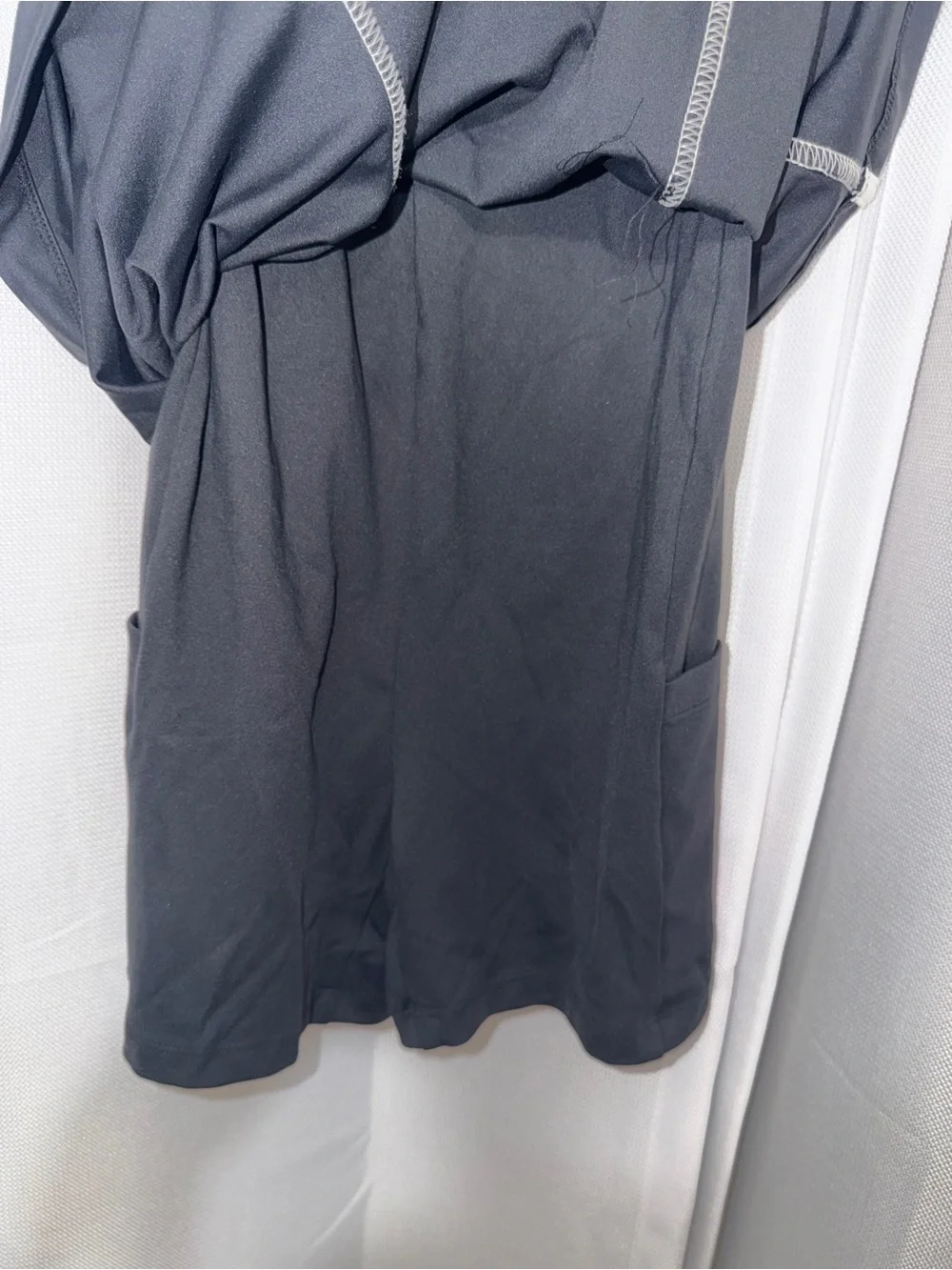 Daily Practice- Black workout dress with white trim and connected spandex shorts